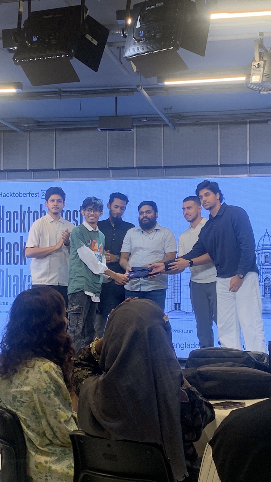 Receiving the 3rd place prize at Hacktoberfest Hack Day Dhaka